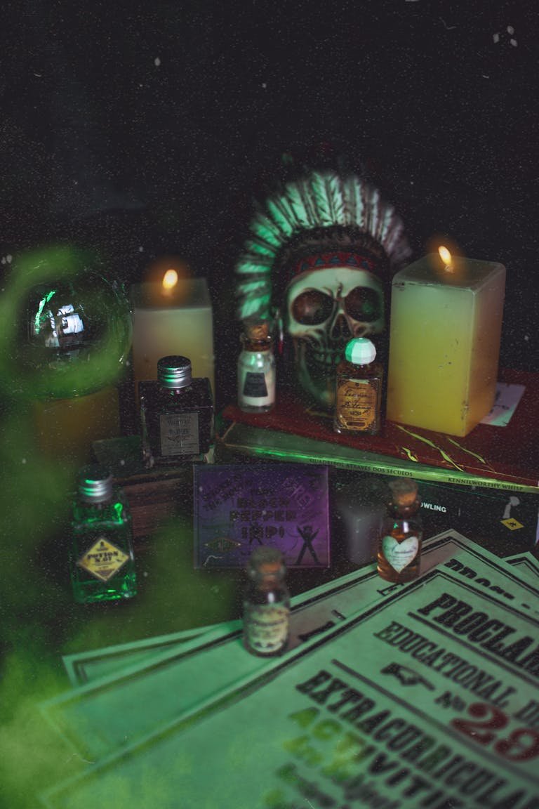 Eerie atmosphere with candles, skull, and mystical potions, perfect for Halloween themes.